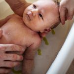 What age can baby sit in bath without seat