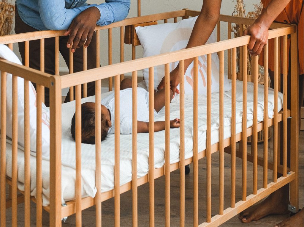 When to lower crib