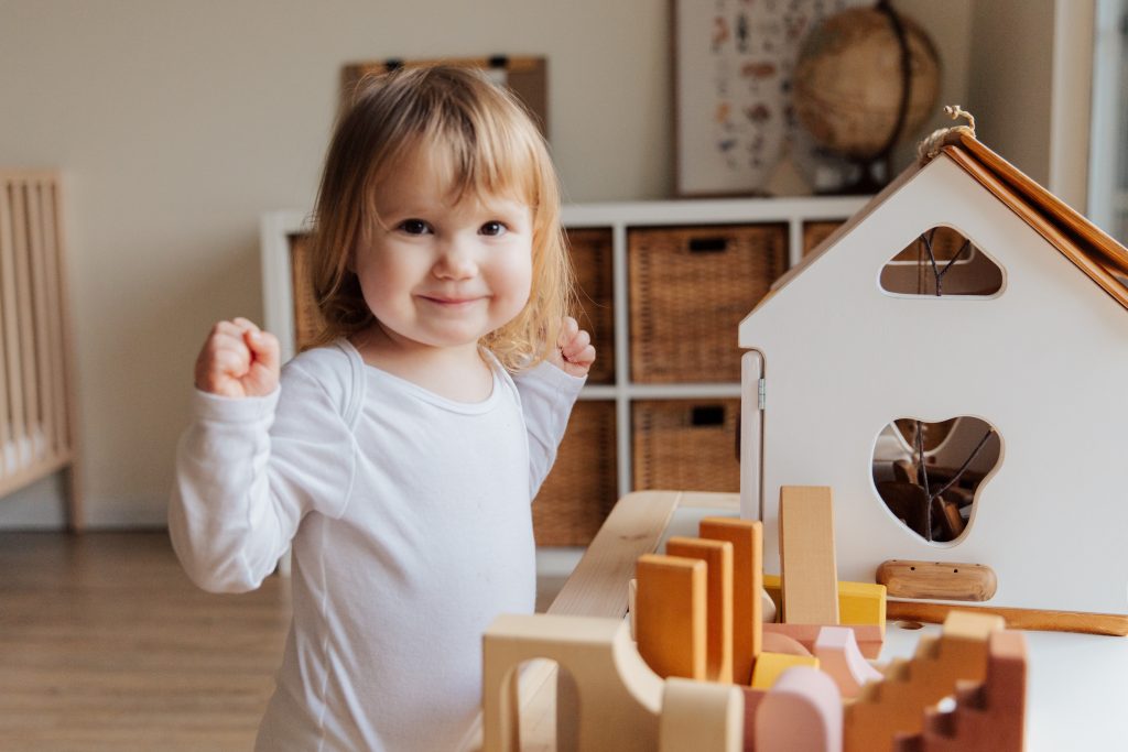When do babies start playing with toys