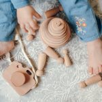 When do babies start playing with toys