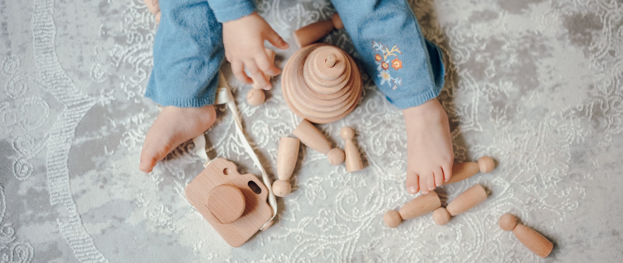 When do babies start playing with toys